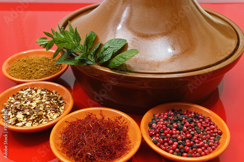 Moroccan tahine with four bowls with spices and fresh mint photo