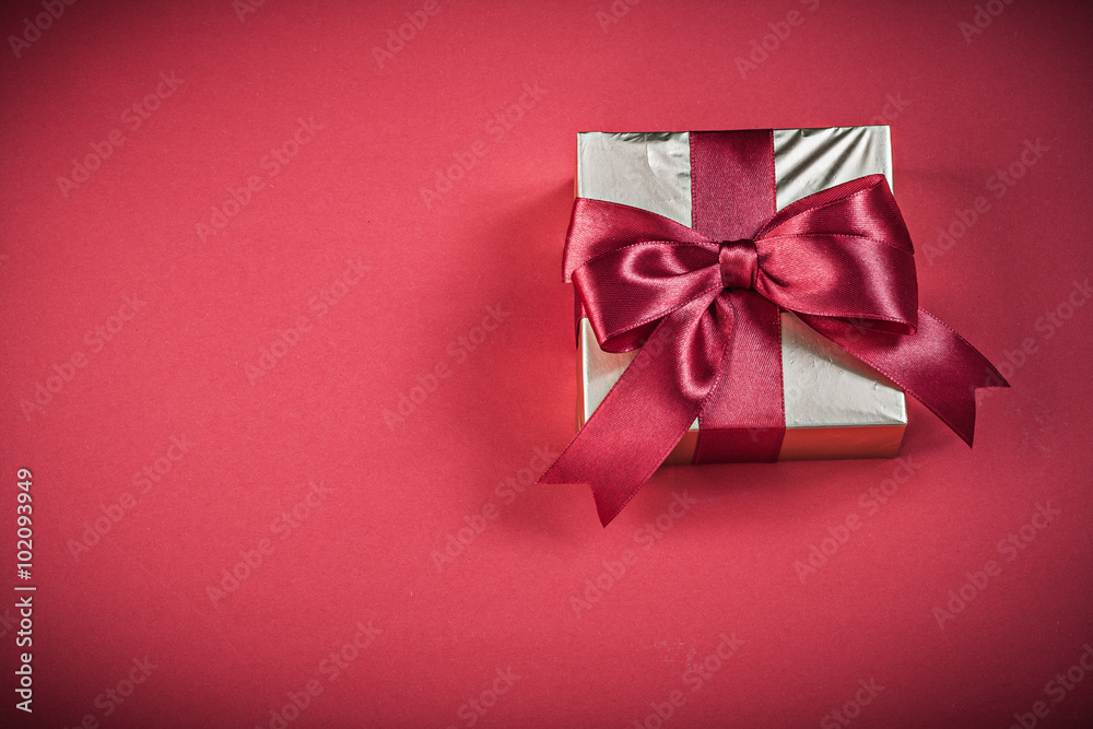Gift box on red background holidays concept Gift box on red background holidays concept