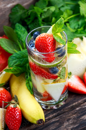 Glass of fresh strawberry detox water with fruit
