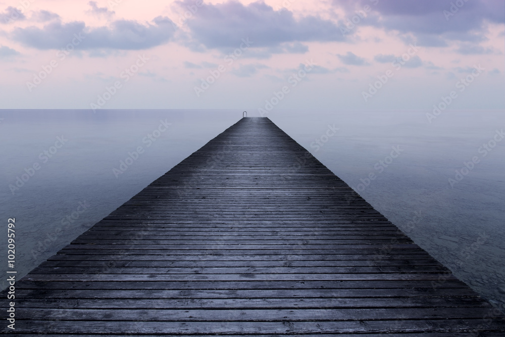 Fototapeta premium Long exposure at sunset on an old pier