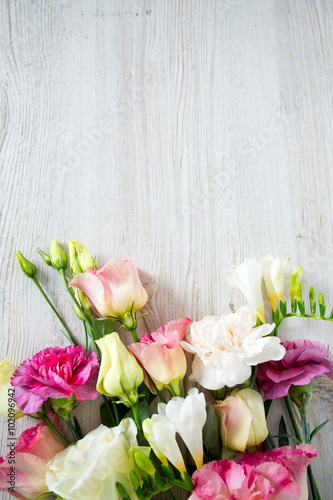 bouquet of beautiful flowers on wooden surface
