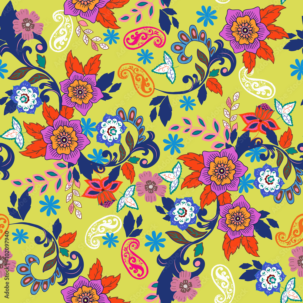 Paisley seamless texture with colorful flowers and leafs on yellow background.