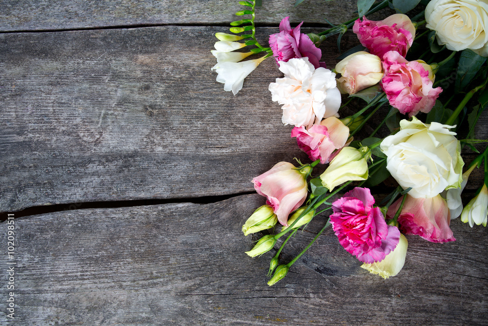 bouquet of beautiful flowers on wooden surface