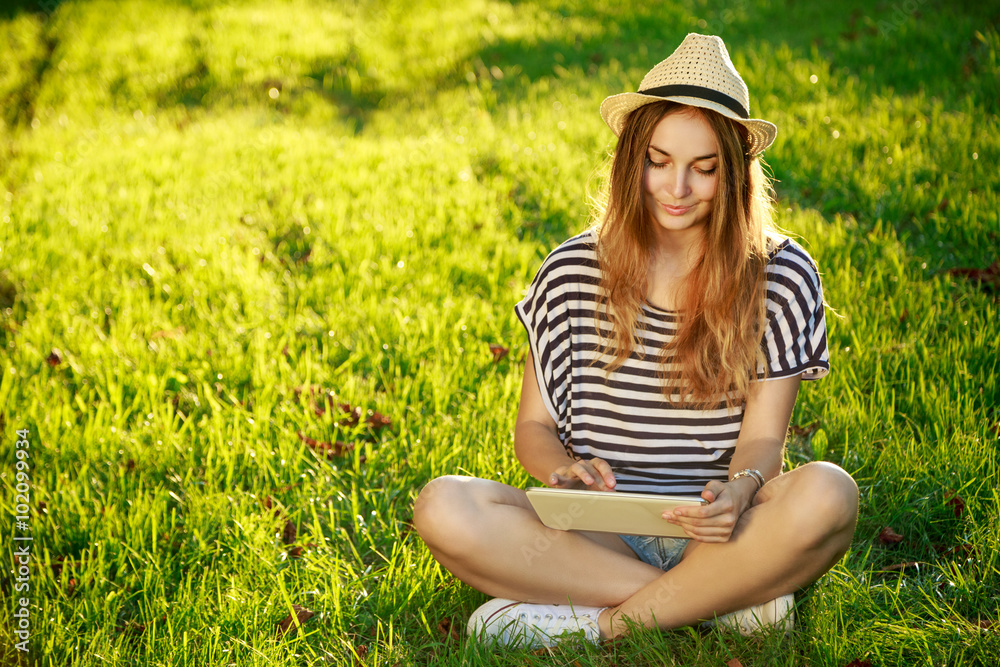 Happy Hipster Girl Using Tablet Outdoors Happy Hipster Girl Using Tablet Outdoors
