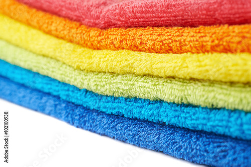 Rainbow colored pile of towels isolated