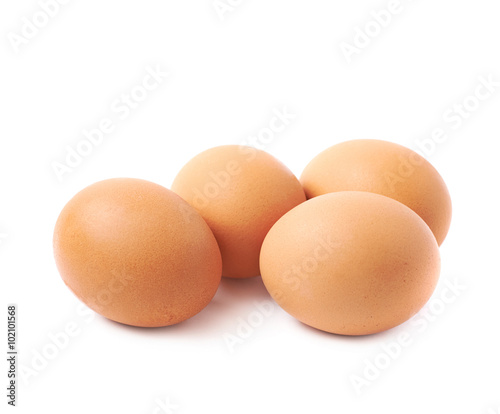 Four brown eggs composition isolated