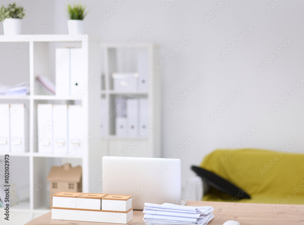 Modern office interior with tables, chairs and bookcases