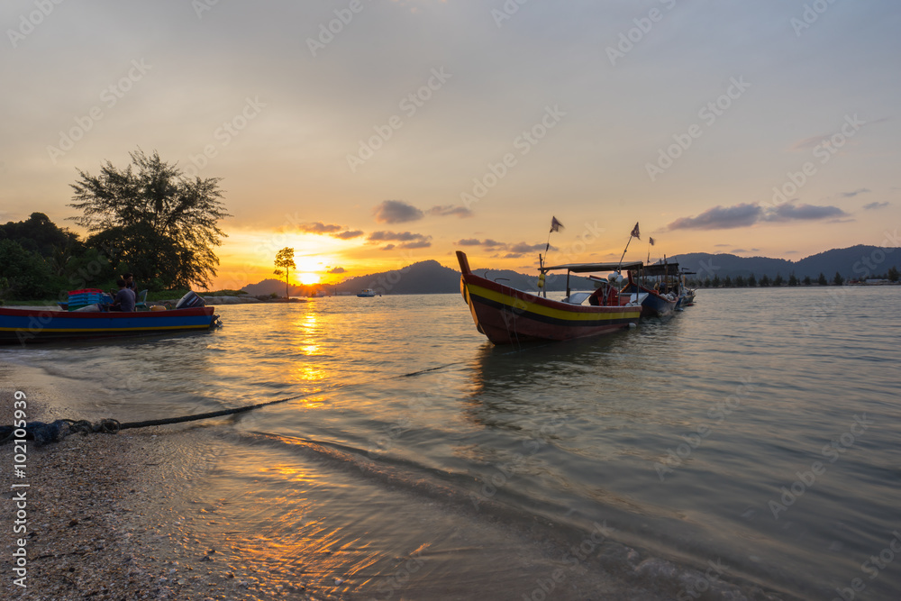Fisherman boat at the beach during sunset Fisherman boat at the beach during sunset