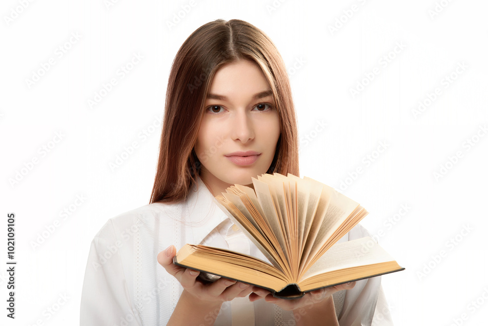 young woman holding book with open pages