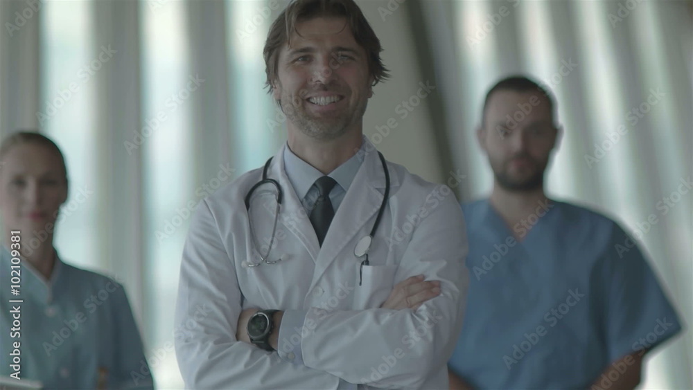 group of medical staff at hospital, doctor in front of team, people group standing together in background group of medical staff at hospital, doctor in front of team, people group standing together in background