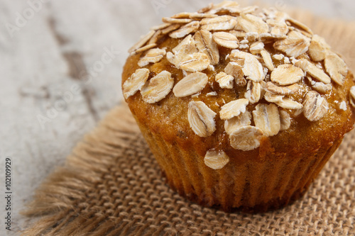 Fresh muffin with oatmeal baked with wholemeal flour, delicious healthy dessert © ratmaner