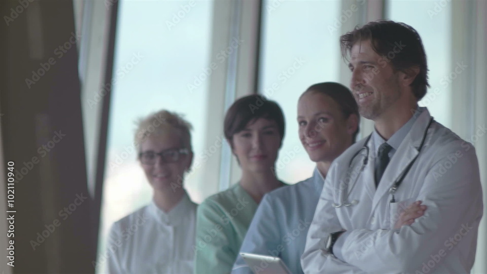 group of medical staff at hospital, doctor in front of team, people group standing together in background group of medical staff at hospital, doctor in front of team, people group standing together in background