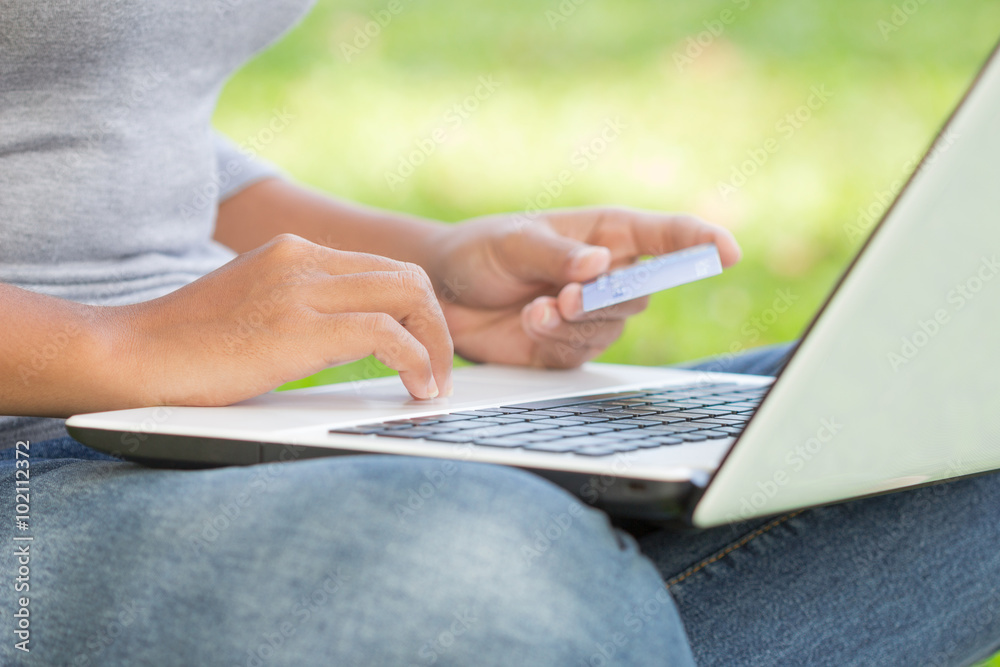 closeup woman using credit card purchase on internet closeup woman using credit card purchase on internet