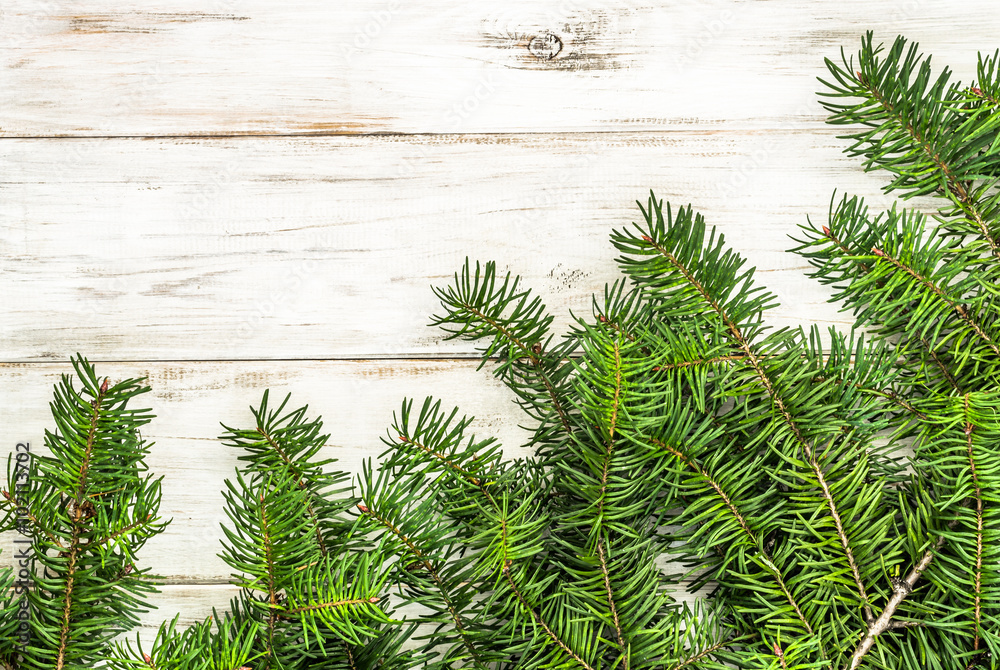 Twigs spruce on wooden planks background with copy-space. Twigs spruce on wooden planks background with copy-space.