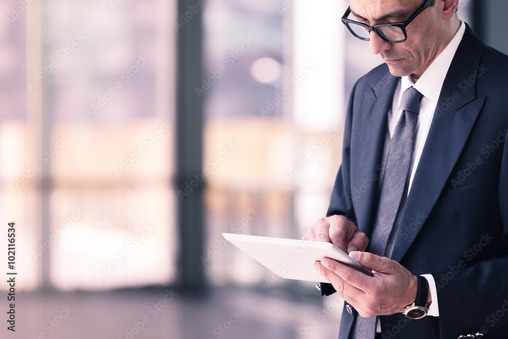 Fototapeta premium businessman using tablet computer in office