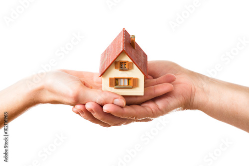 house held by two hands