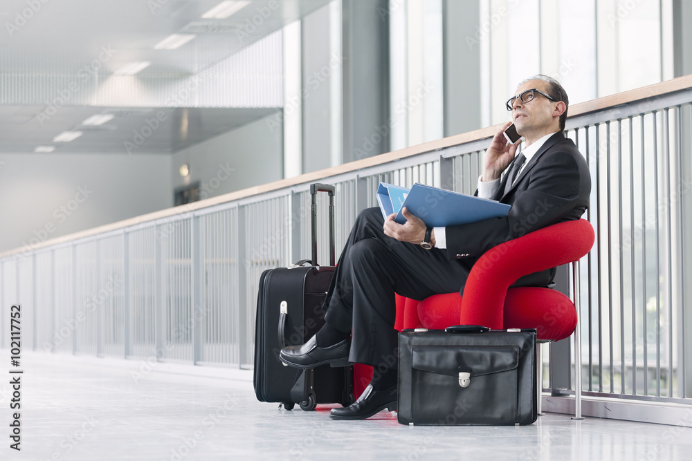 Fototapeta premium Business man with phone and catalog