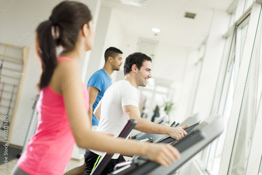 Young people training in the gym Young people training in the gym