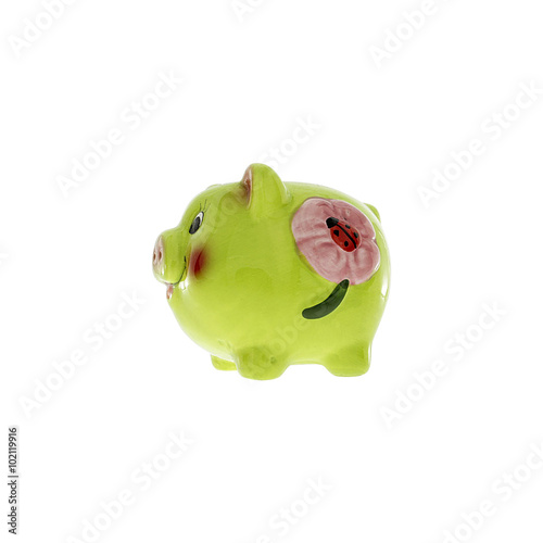 Green ceramic piggy bank isolated on white