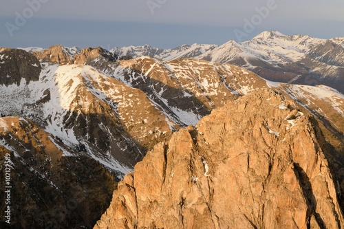 mountain views seen from the Encantats summit at sunset in Aigüestortes, Catalonia photo