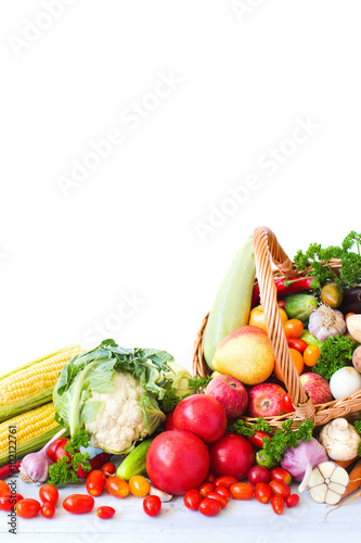 Fototapeta Naklejka Na Ścianę i Meble -  Heap of fresh fruits and vegetables in basket isolated on white.