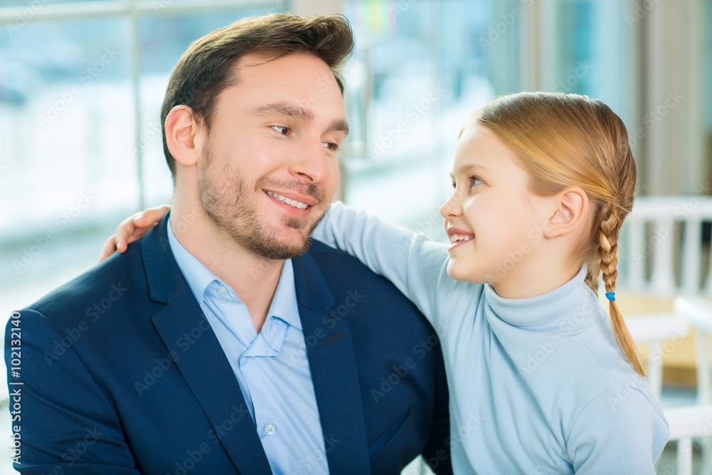 Handsome young father enjoying time with daughter. Handsome young father enjoying time with daughter.