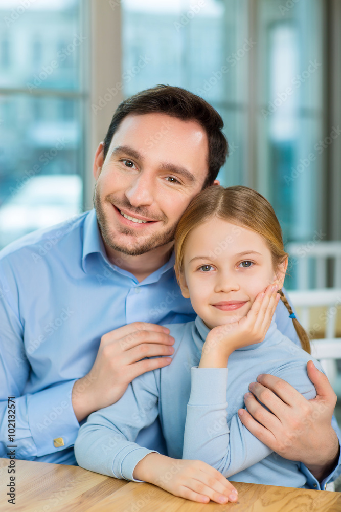 Fototapeta premium Young father realizing happiness to be a parent.