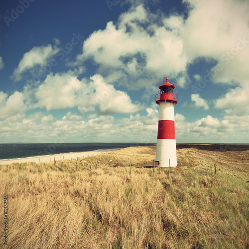 scenic lighthouse at the German North Sea island Sylt in the dunes, vintage style, Germany, Europe