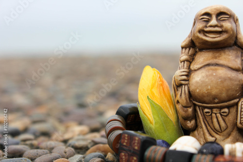 Photos Bracelet and flower with budda figurine