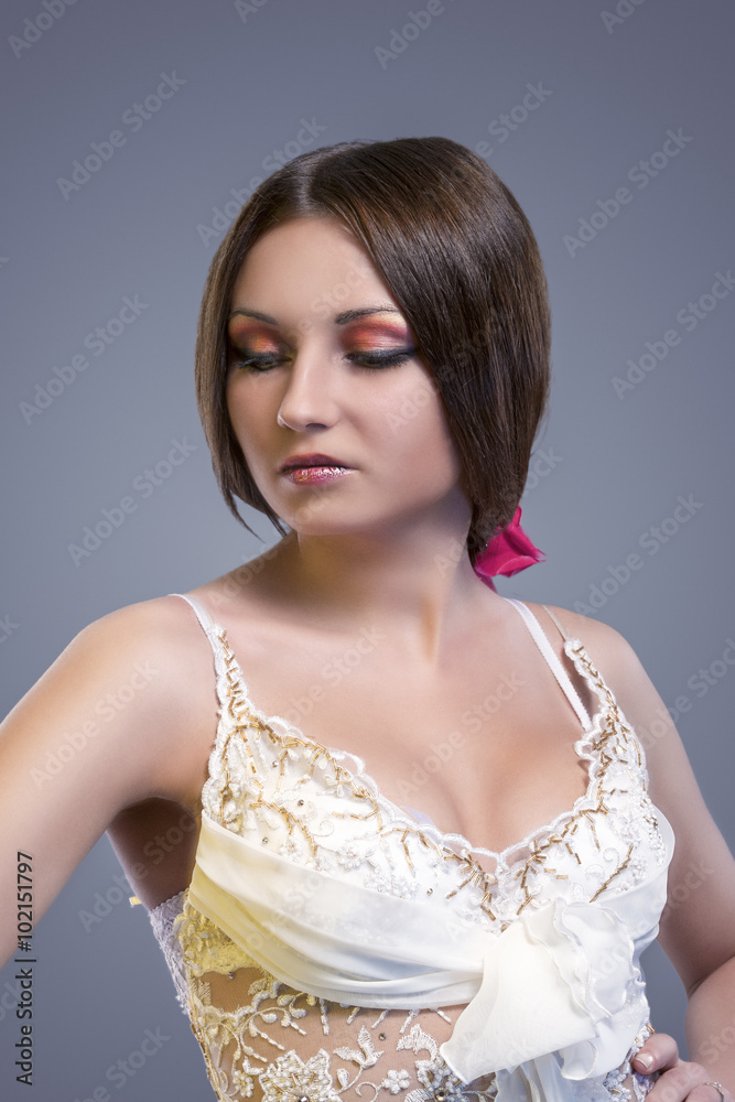 Wedding Dress Concept. Sexy Looking Caucasian Female Posing in Wedding Dress