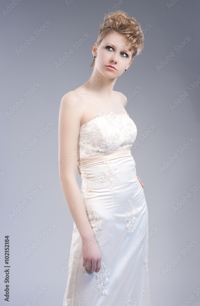 Fashion Concepts. Young Sexy Blond Woman in Nicely Tailored Wedding Dress Fashion Concepts. Young Sexy Blond Woman in Nicely Tailored Wedding Dress