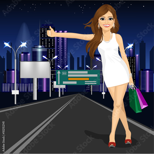 beautiful girl voting on night city road