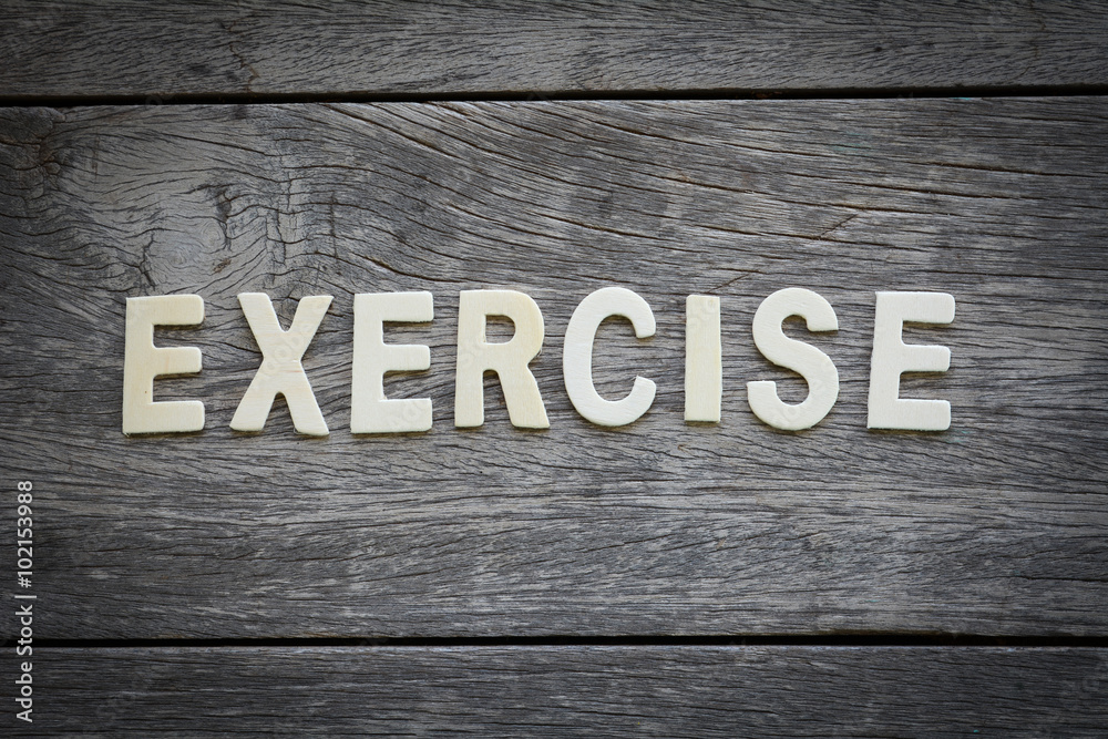 The word exercise on the wooden floor Stock Photo