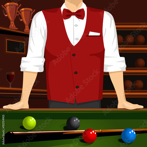 man leaning on a pool table with cue stick and colorful billiard balls