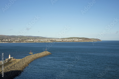 Breakwater at Douglas Bay Isle of Man with a lighthouse photo