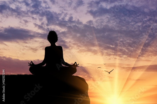 Bild auf Leinwand Silhouette of a girl practicing yoga