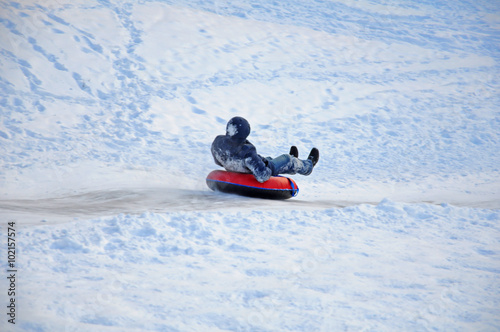 Skating with ice slides on a tubing