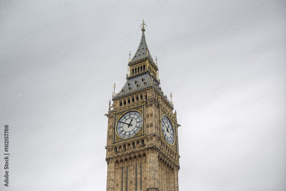 detailed close-up of Elizabeth Tower (Big Ben Clocktower) in front of gray cloudy sky, London, United Kingdom, Europe