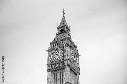 detailed close-up of Elizabeth Tower (Big Ben Clocktower) in front of gray cloudy sky, black and white, London, United Kingdom, Europe