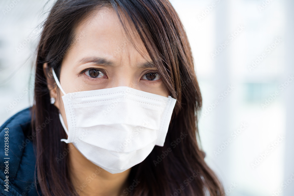 Woman wearing face mask for protection Woman wearing face mask for protection