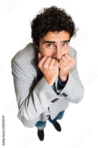 Portrait of a businessman with a funny scared facial expression