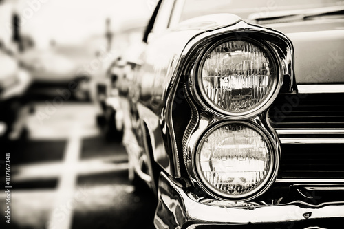 Photograph of a classic vehicle with close-up on headlights. © Mariusz Blach