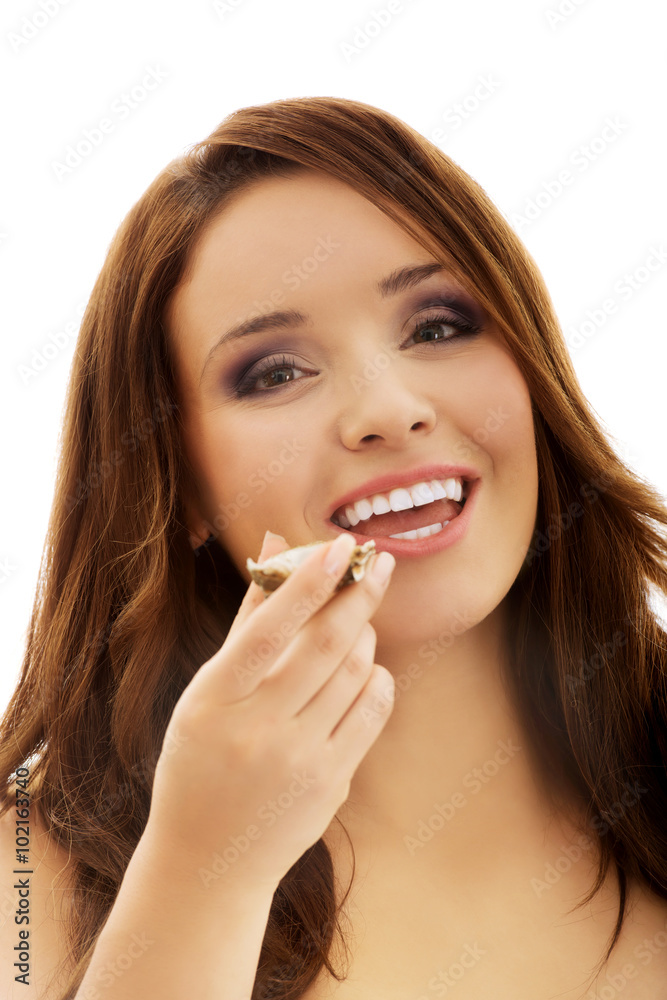 Woman eating fresh oyster with organic lemon. Woman eating fresh oyster with organic lemon.