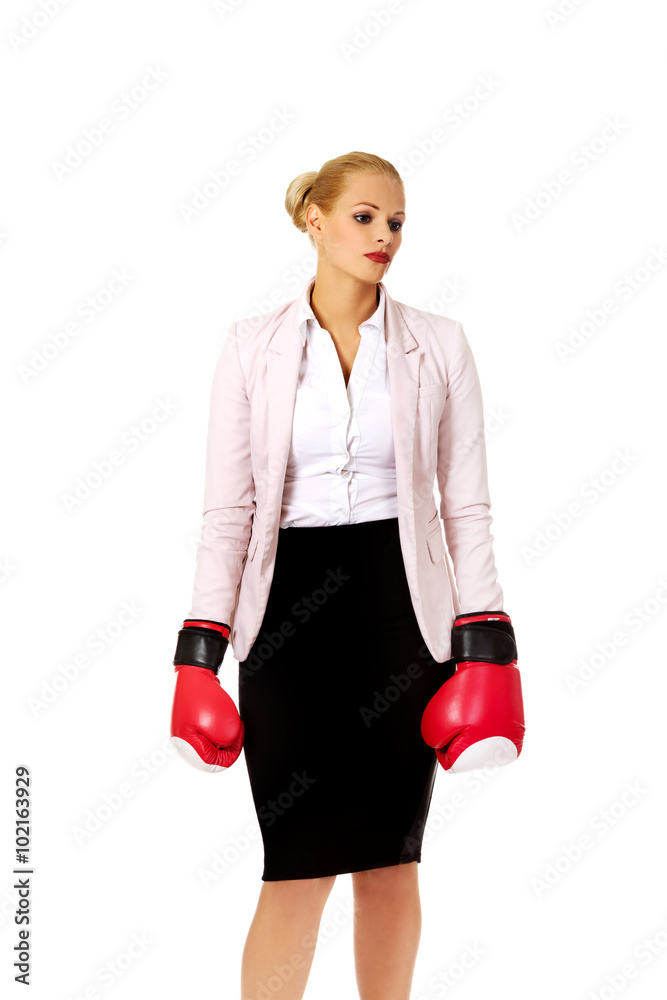 Business woman in red boxing gloves Business woman in red boxing gloves