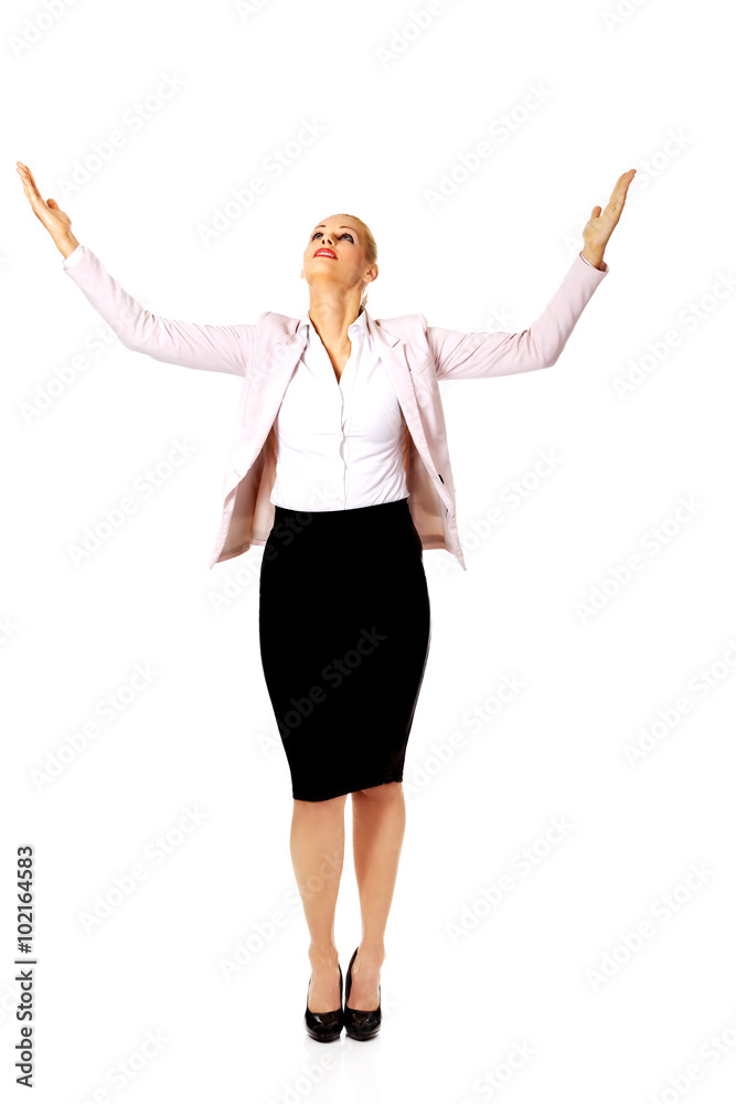 Young businesswoman trying to catch something Young businesswoman trying to catch something