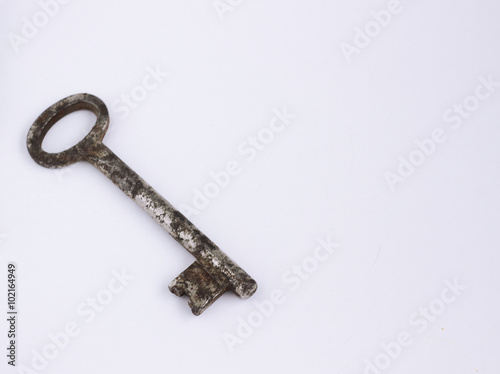 old rusty key on white background © voldemar_lemberg