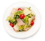 Vegetable salad with ham, parmesan cheese and cherry tomatoes.
