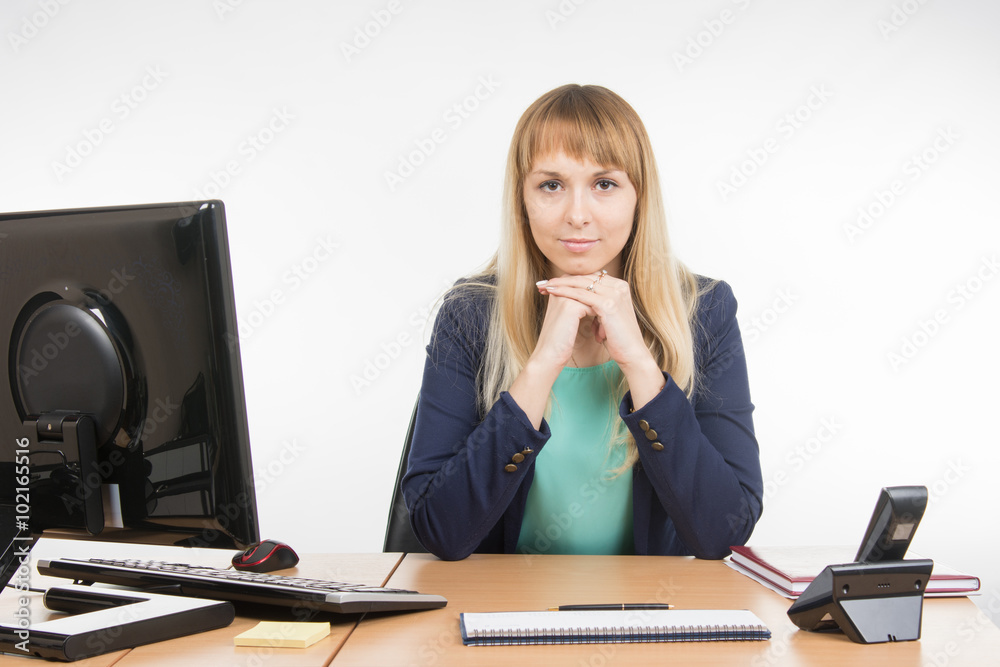 Strict head sitting at a desk Strict head sitting at a desk