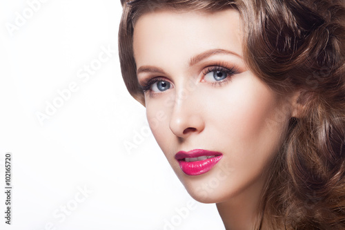 Close up portrait of young beautiful model girl with make-up and coiffure