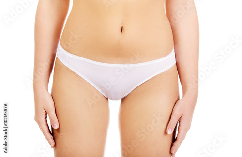 Body of slim young woman in white underwear